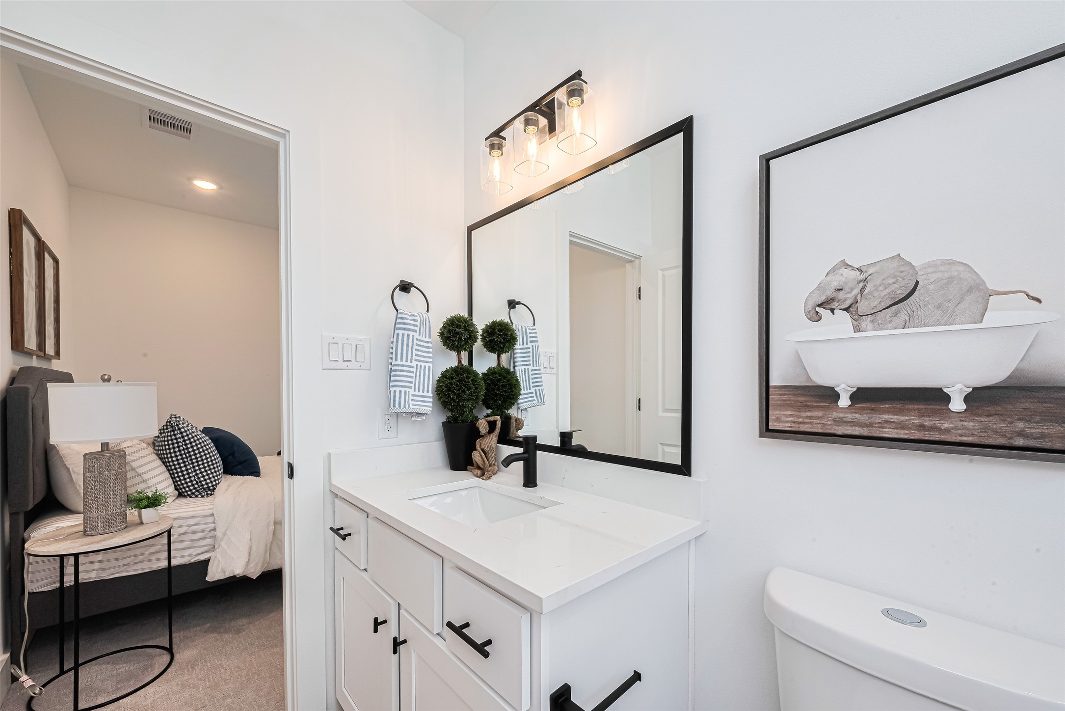 9437 Pembrook Street Houston, TX 77016 - Photo 22 of 25 a bathroom with a sink and a mirror