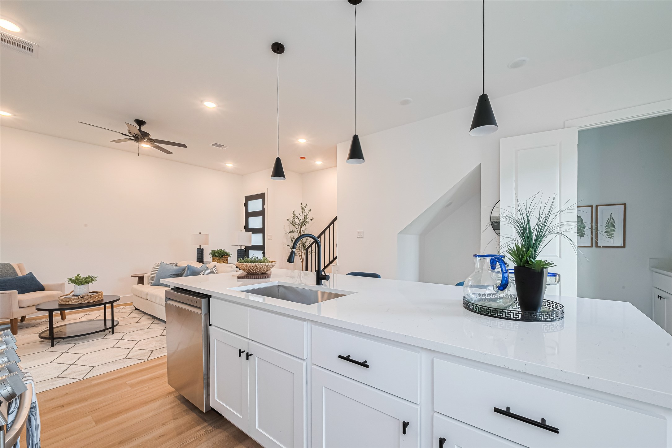 9437 Pembrook Street Houston, TX 77016 - Photo 7 of 25 a kitchen with a sink and a potted plant