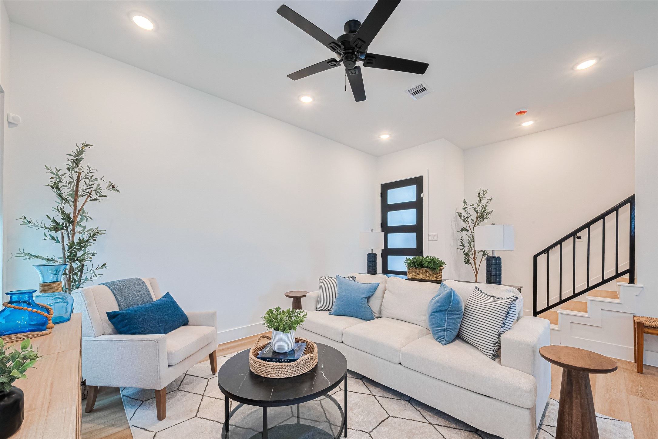 9437 Pembrook Street Houston, TX 77016 - Photo 9 of 25 a living room with furniture and a potted plant