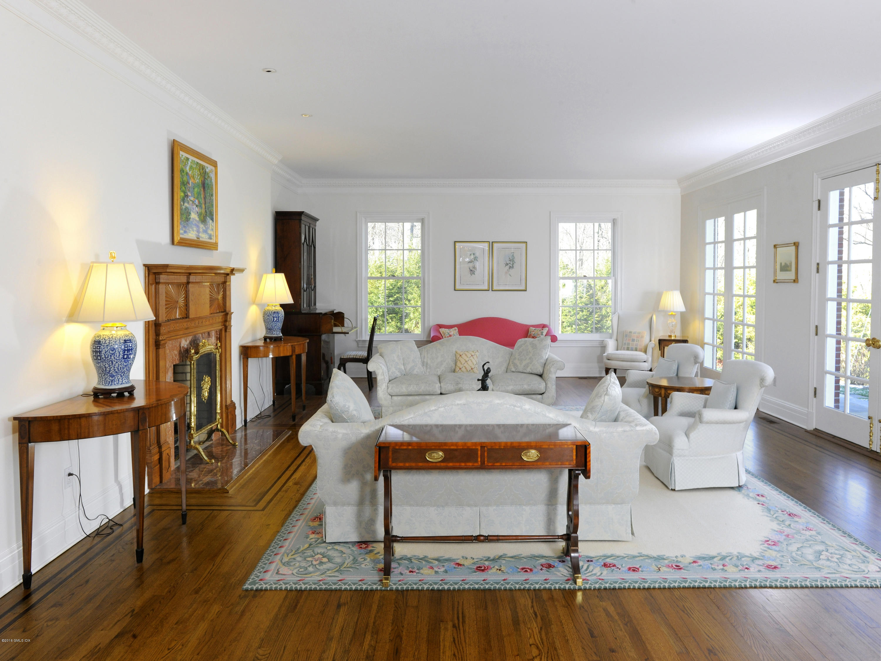 526 North Street Greenwich, CT 06830 - Photo 11 of 40 a living room with furniture a window and a table