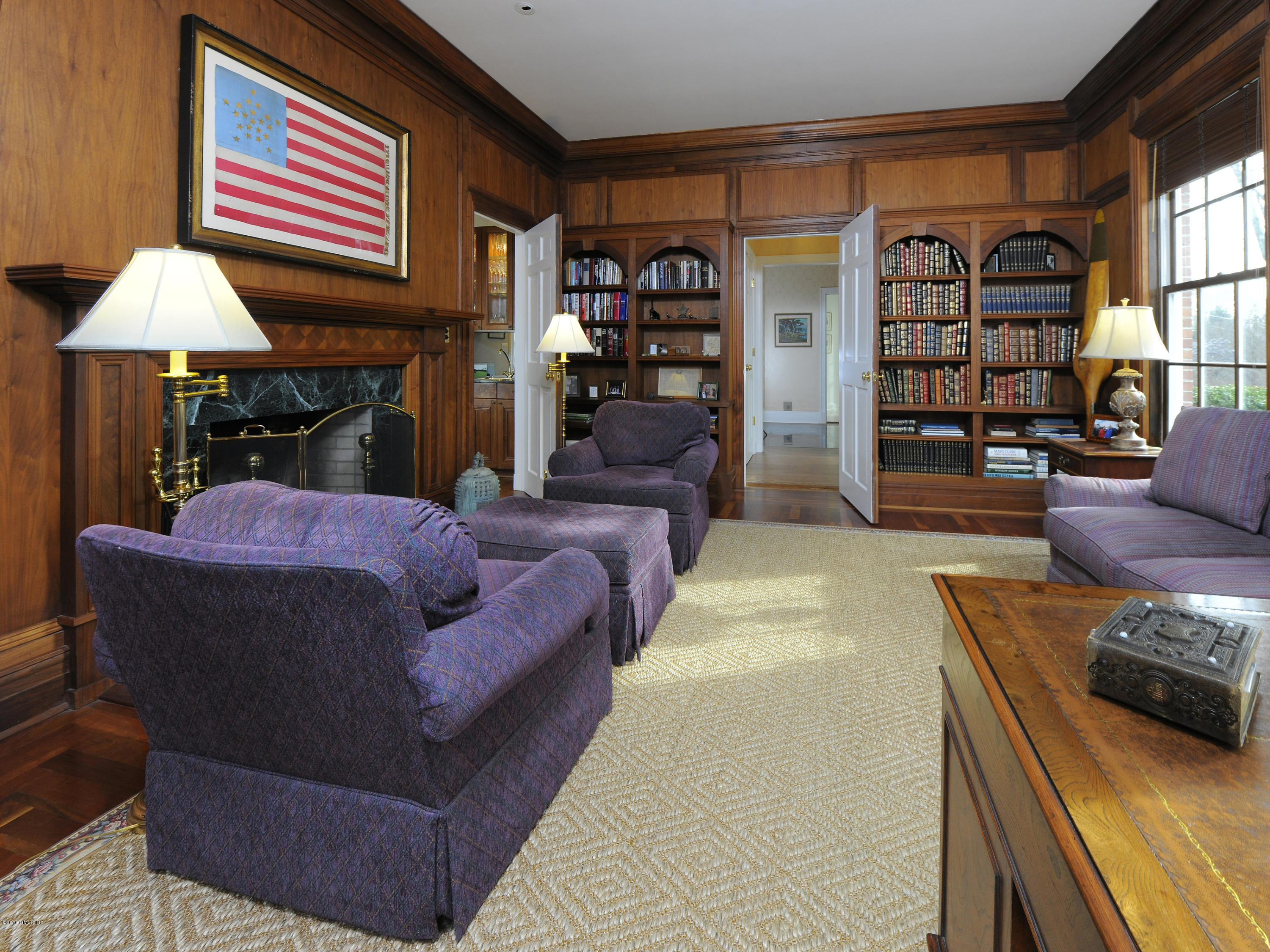 526 North Street Greenwich, CT 06830 - Photo 15 of 40 a living room with furniture and a fireplace