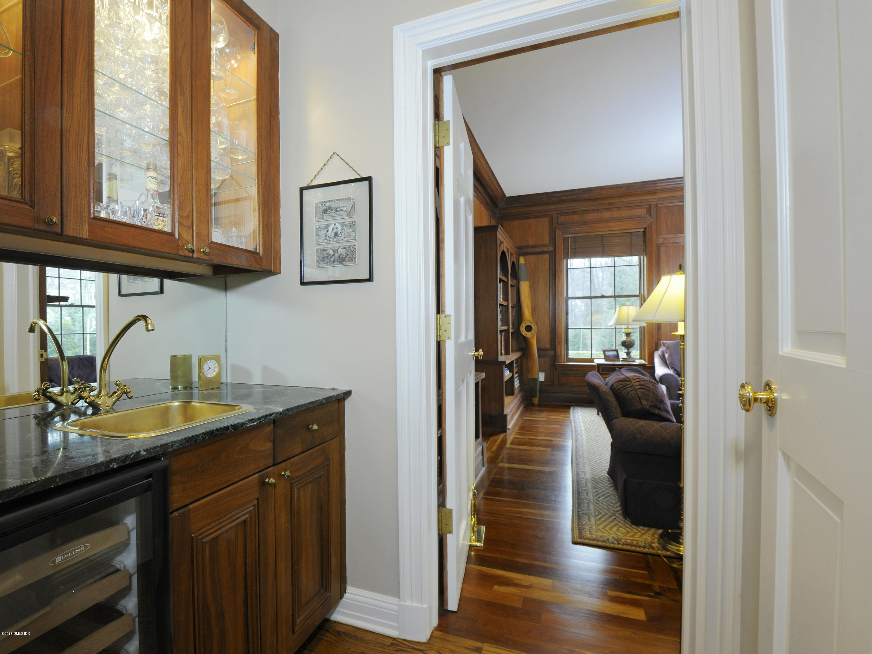 526 North Street Greenwich, CT 06830 - Photo 16 of 40 a en suite bathroom with a granite countertop sink and mirror