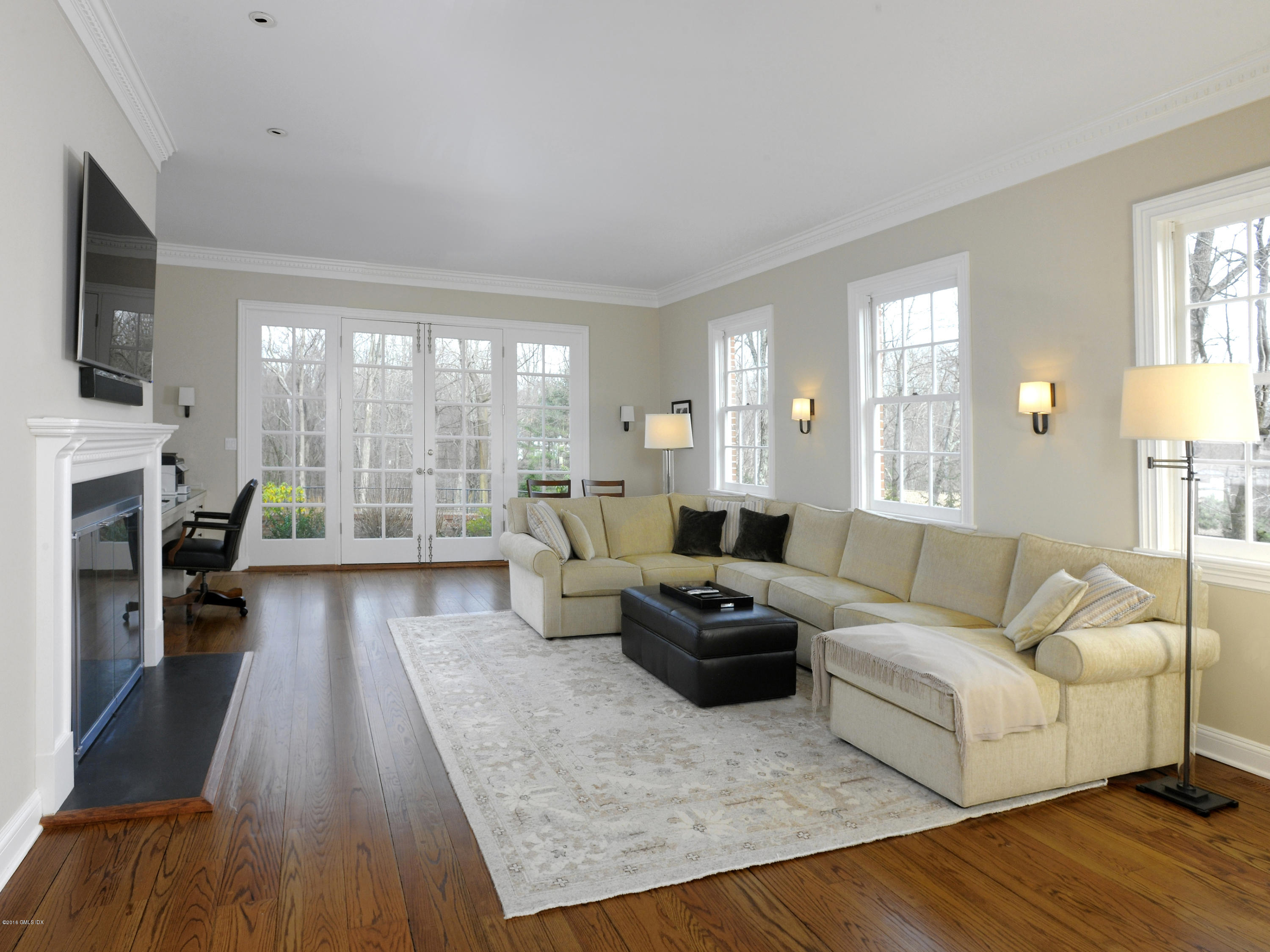 526 North Street Greenwich, CT 06830 - Photo 19 of 40 a living room with furniture and a fireplace