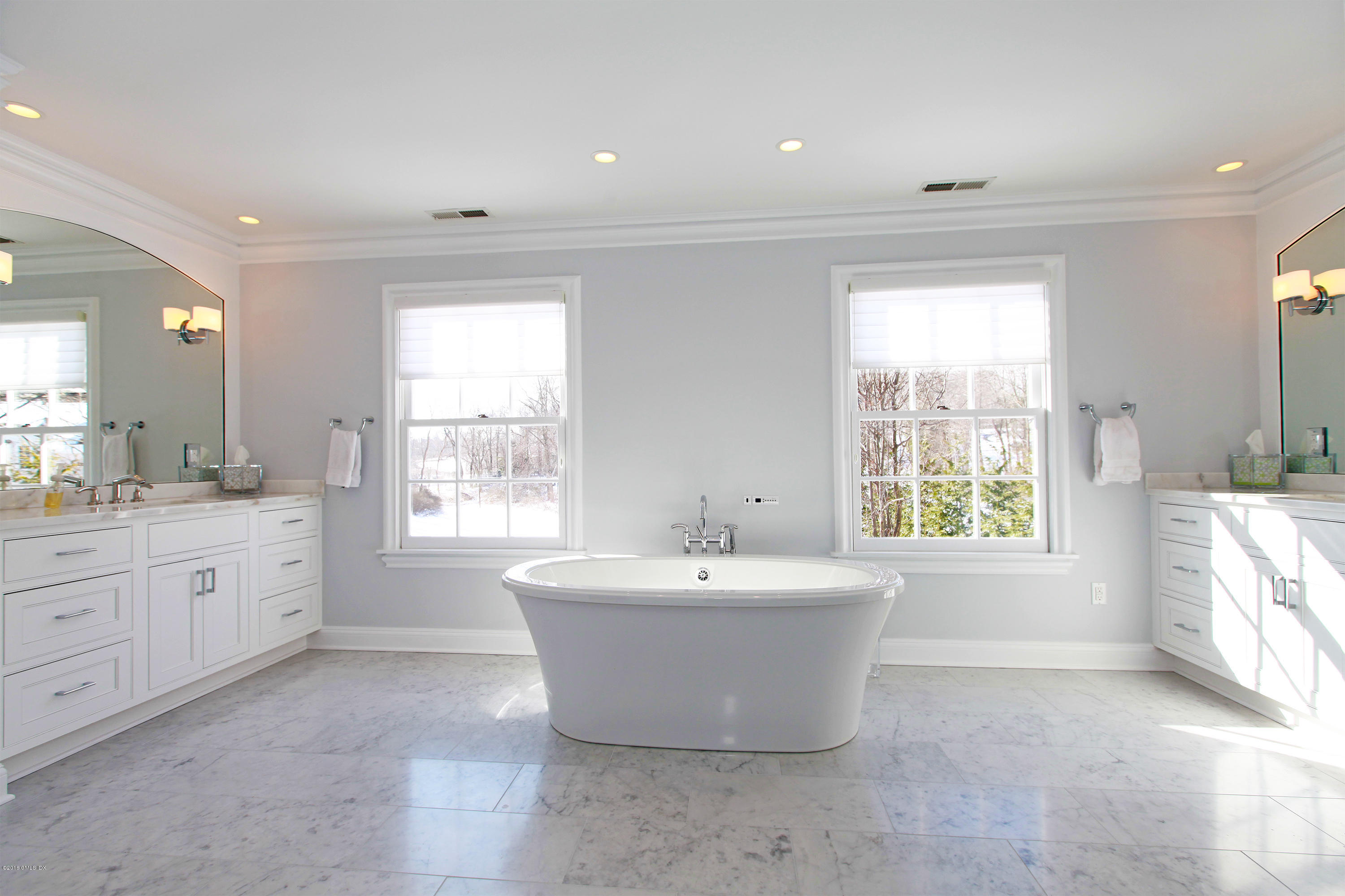 526 North Street Greenwich, CT 06830 - Photo 24 of 40 a spacious bathroom with sink shower and mirror