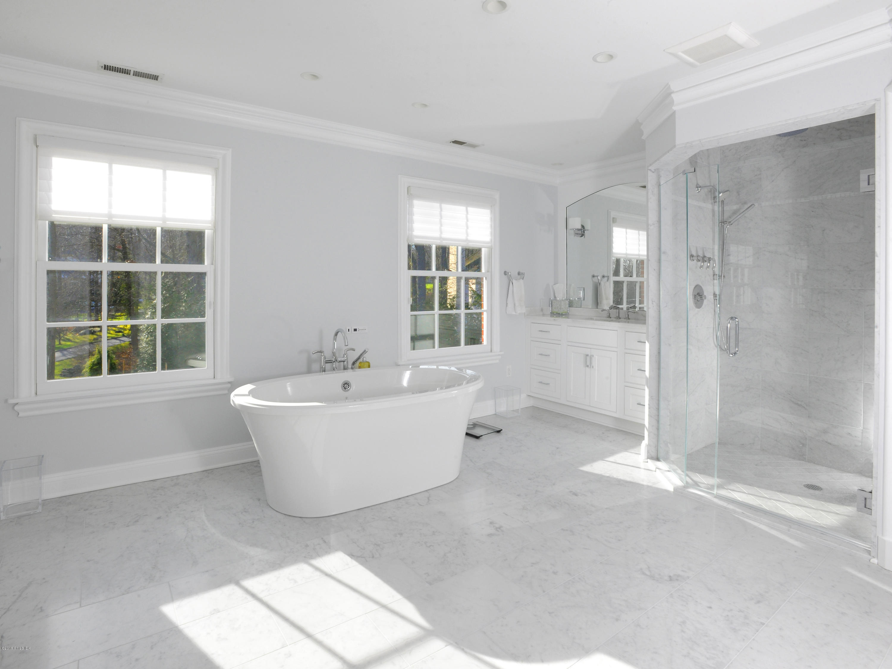 526 North Street Greenwich, CT 06830 - Photo 25 of 40 a bathroom with a bathtub and shower