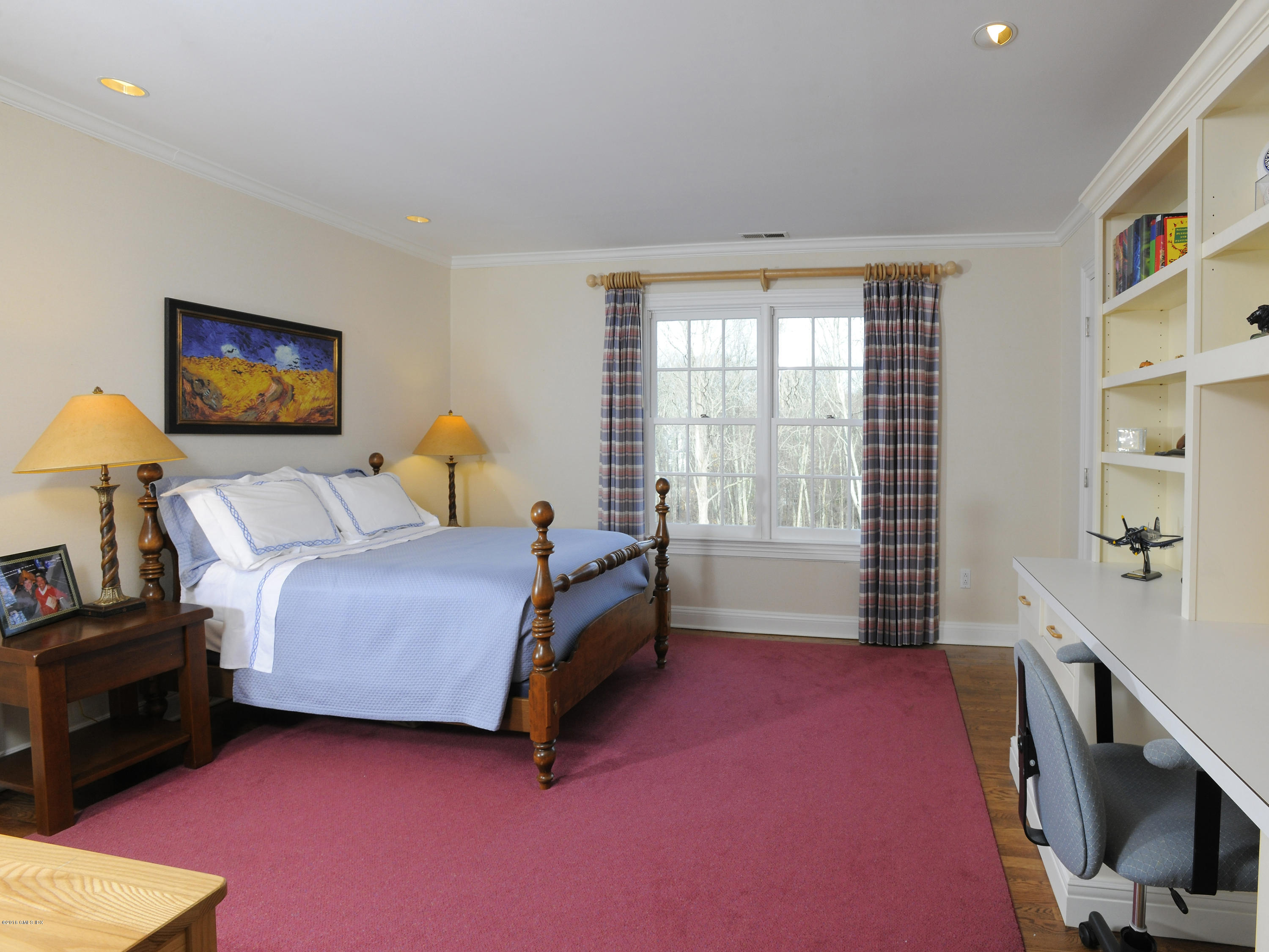 526 North Street Greenwich, CT 06830 - Photo 27 of 40 a bedroom with a bed and a flat screen tv