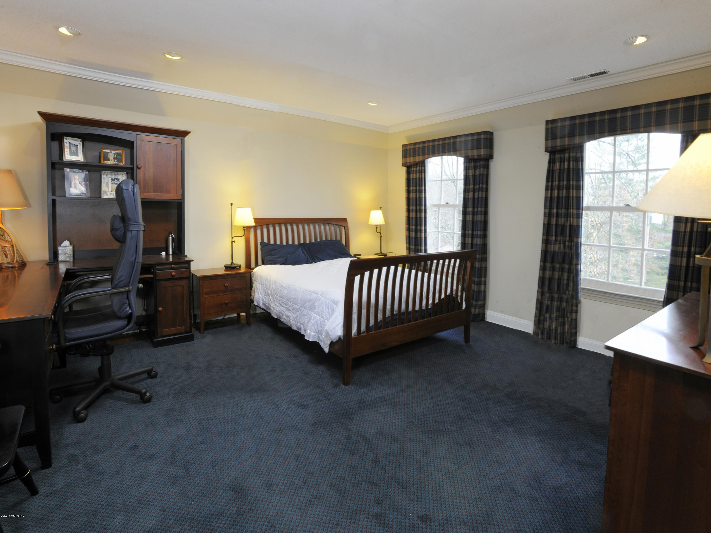 526 North Street Greenwich, CT 06830 - Photo 29 of 40 a bed room with a bed and a window