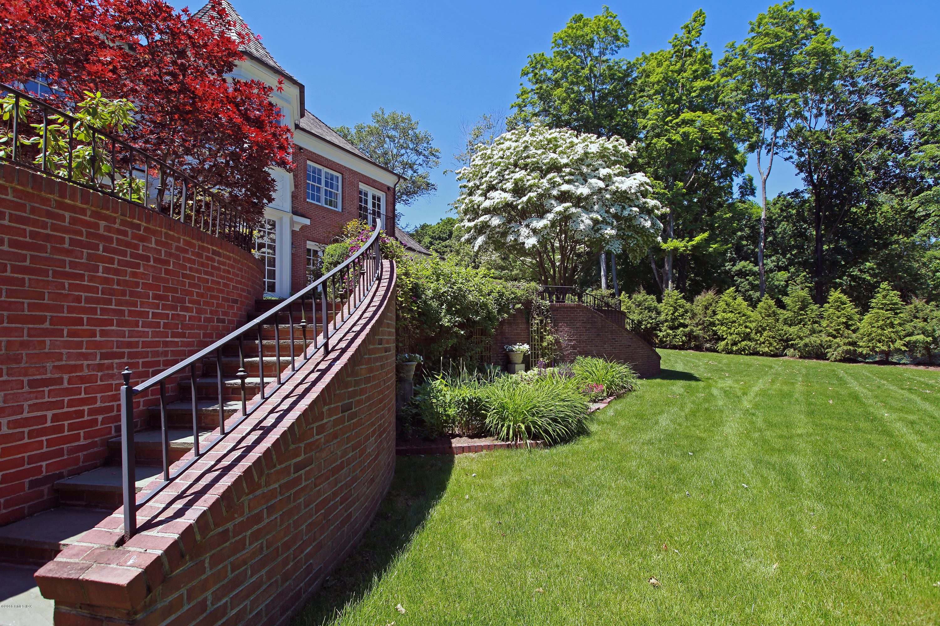 526 North Street Greenwich, CT 06830 - Photo 34 of 40 a view of a house with a yard
