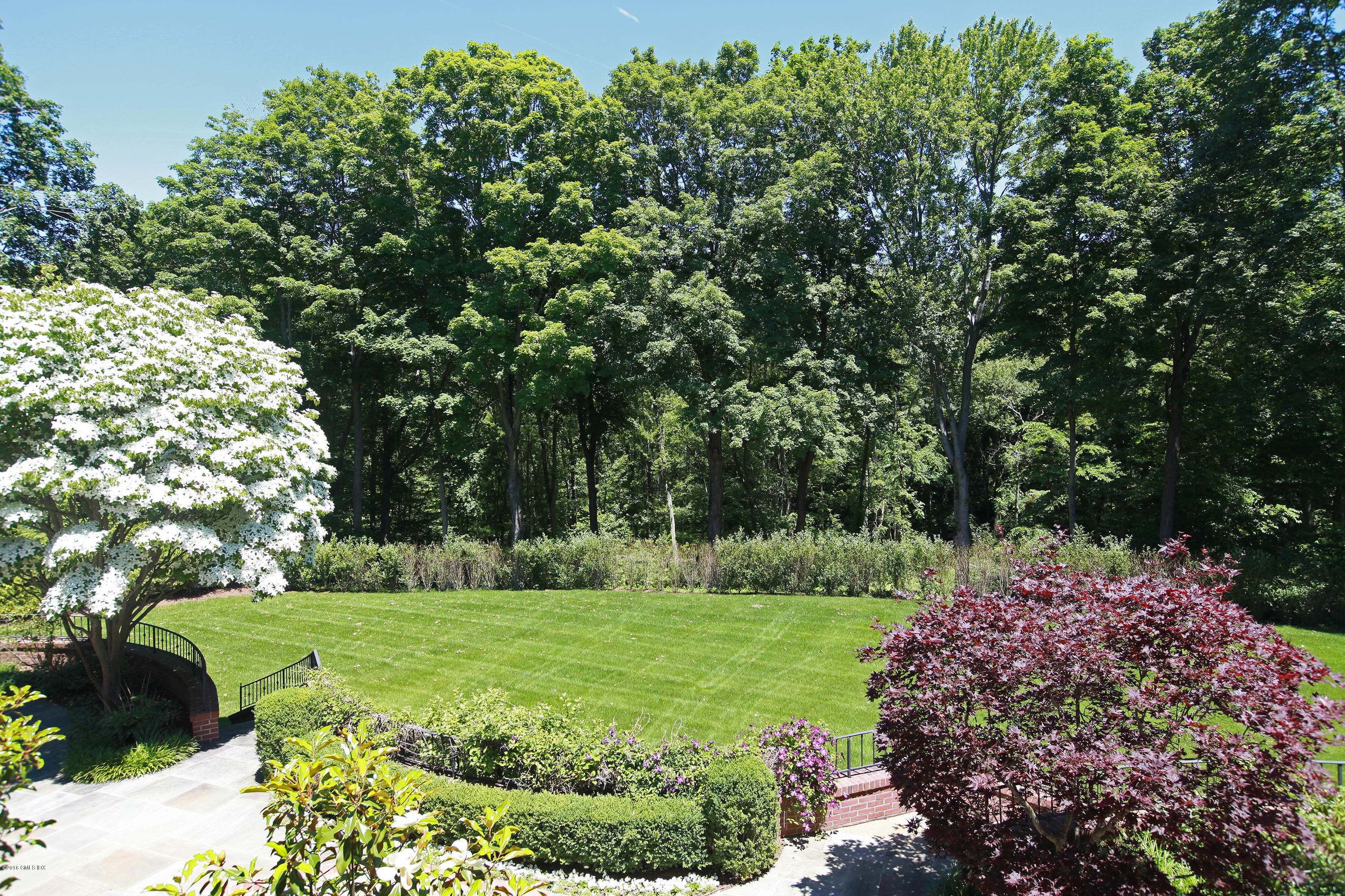 526 North Street Greenwich, CT 06830 - Photo 35 of 40 a view of a garden with trees