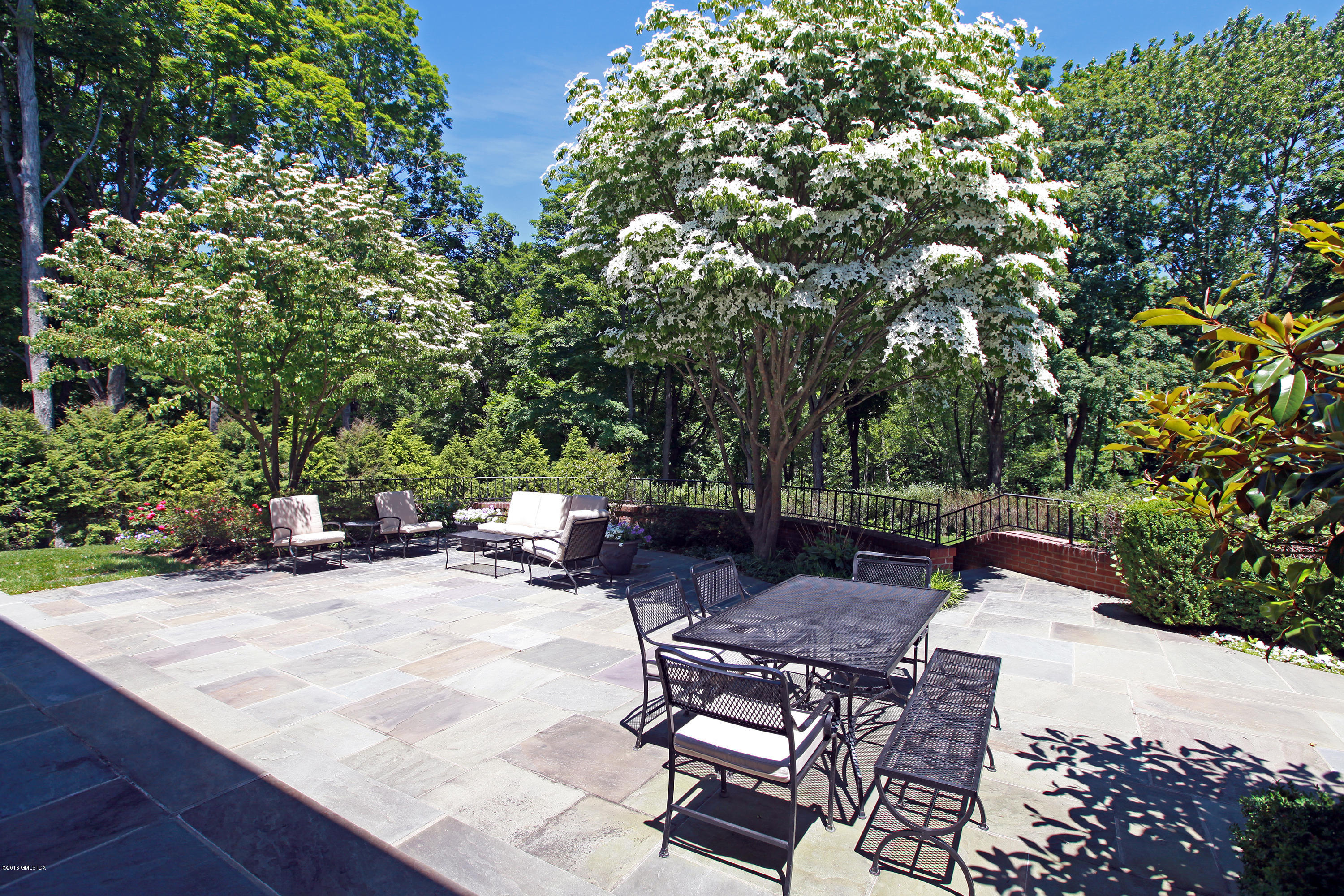 526 North Street Greenwich, CT 06830 - Photo 37 of 40 a view of backyard with outdoor seating and trees