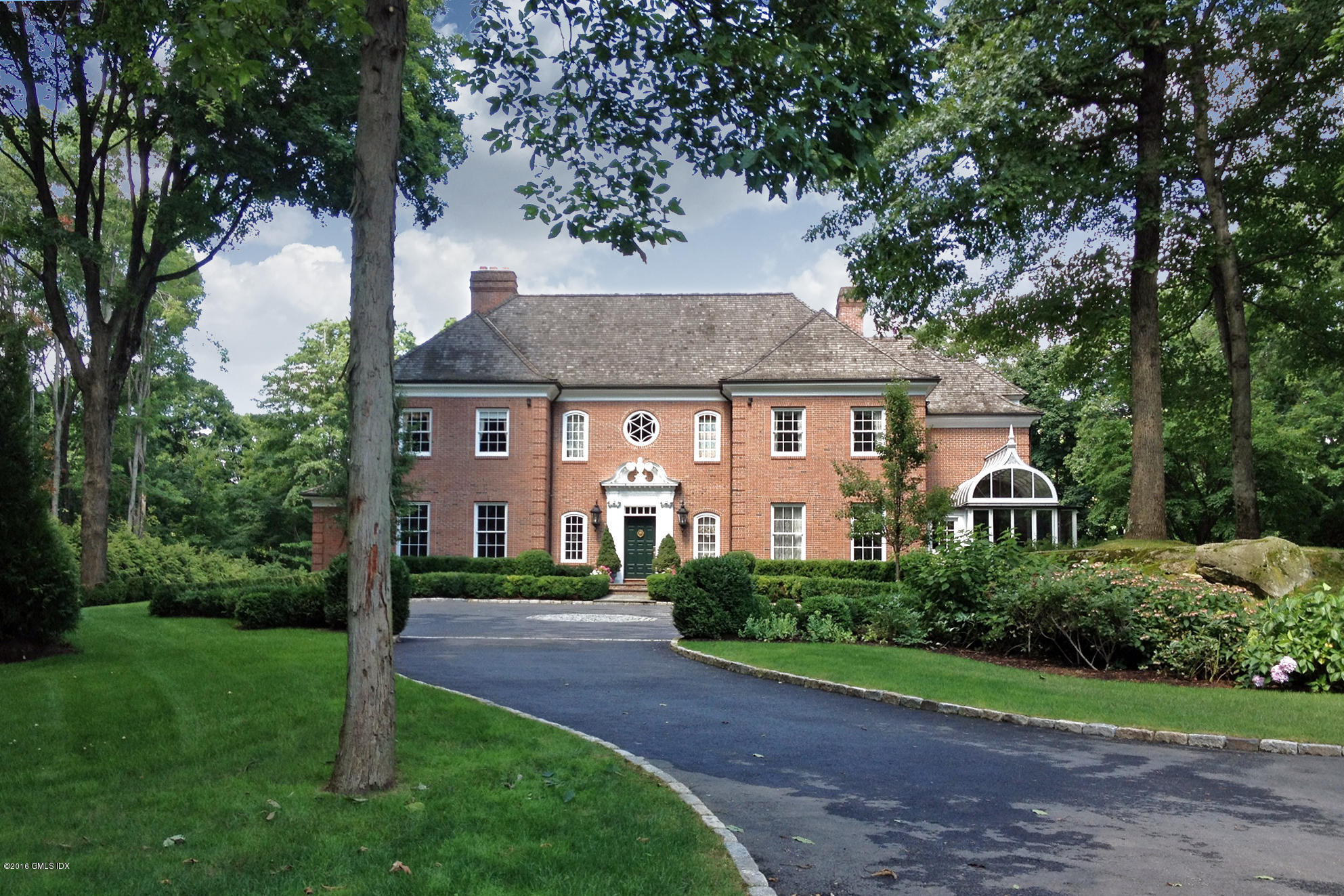 526 North Street Greenwich, CT 06830 - Photo 40 of 40 a front view of a house with a yard