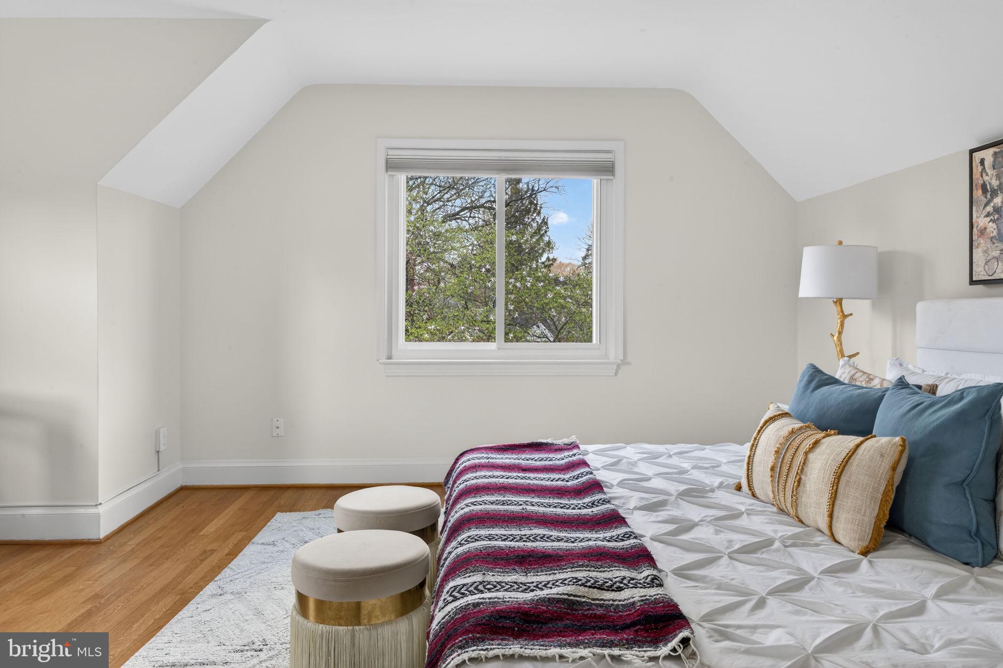 406 Dale Drive Silver Spring, MD 20910 - Photo 32 of 60 a bedroom with a bed and wooden floor