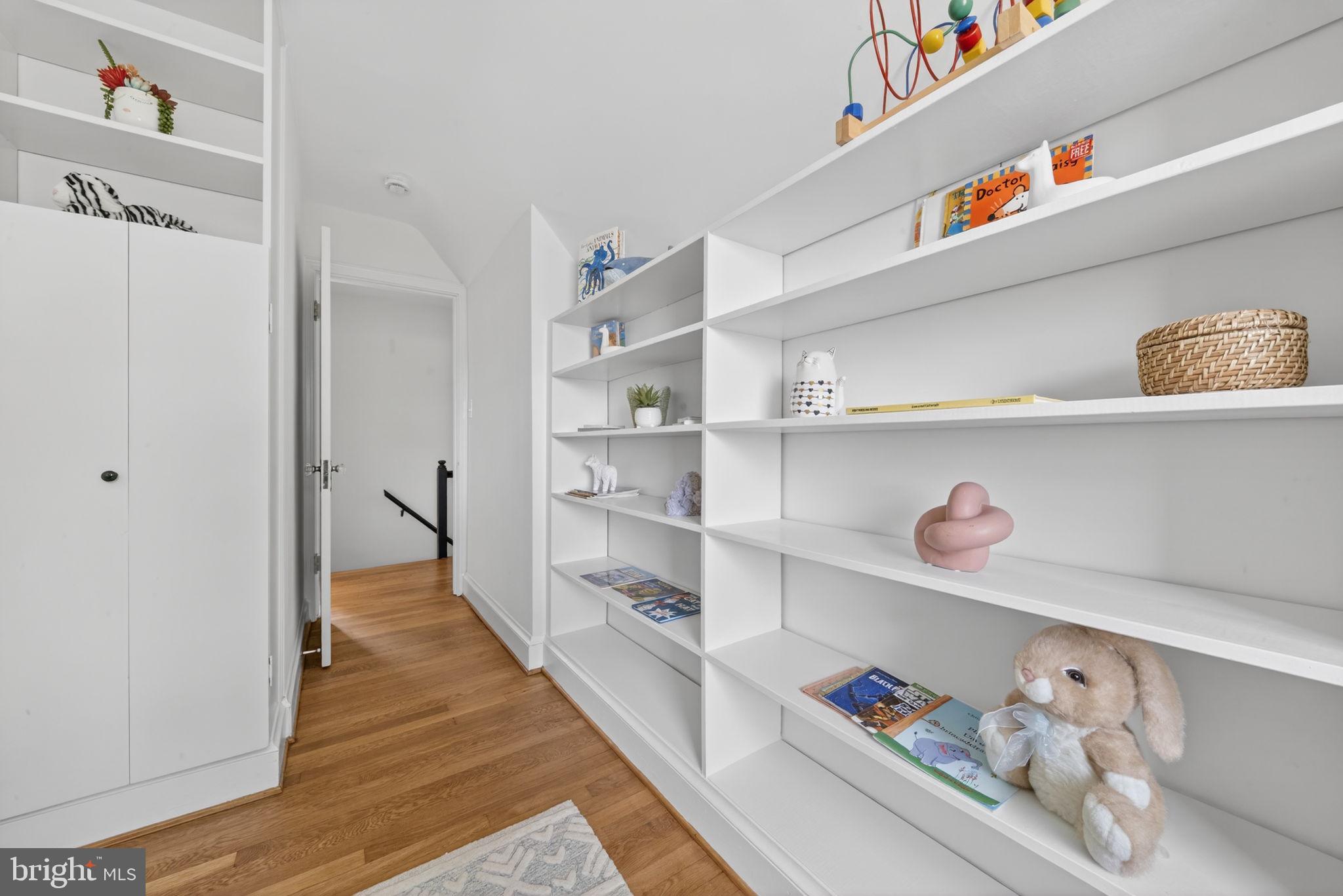 406 Dale Drive Silver Spring, MD 20910 - Photo 39 of 60 a hallway with white cabinets with wooden floor