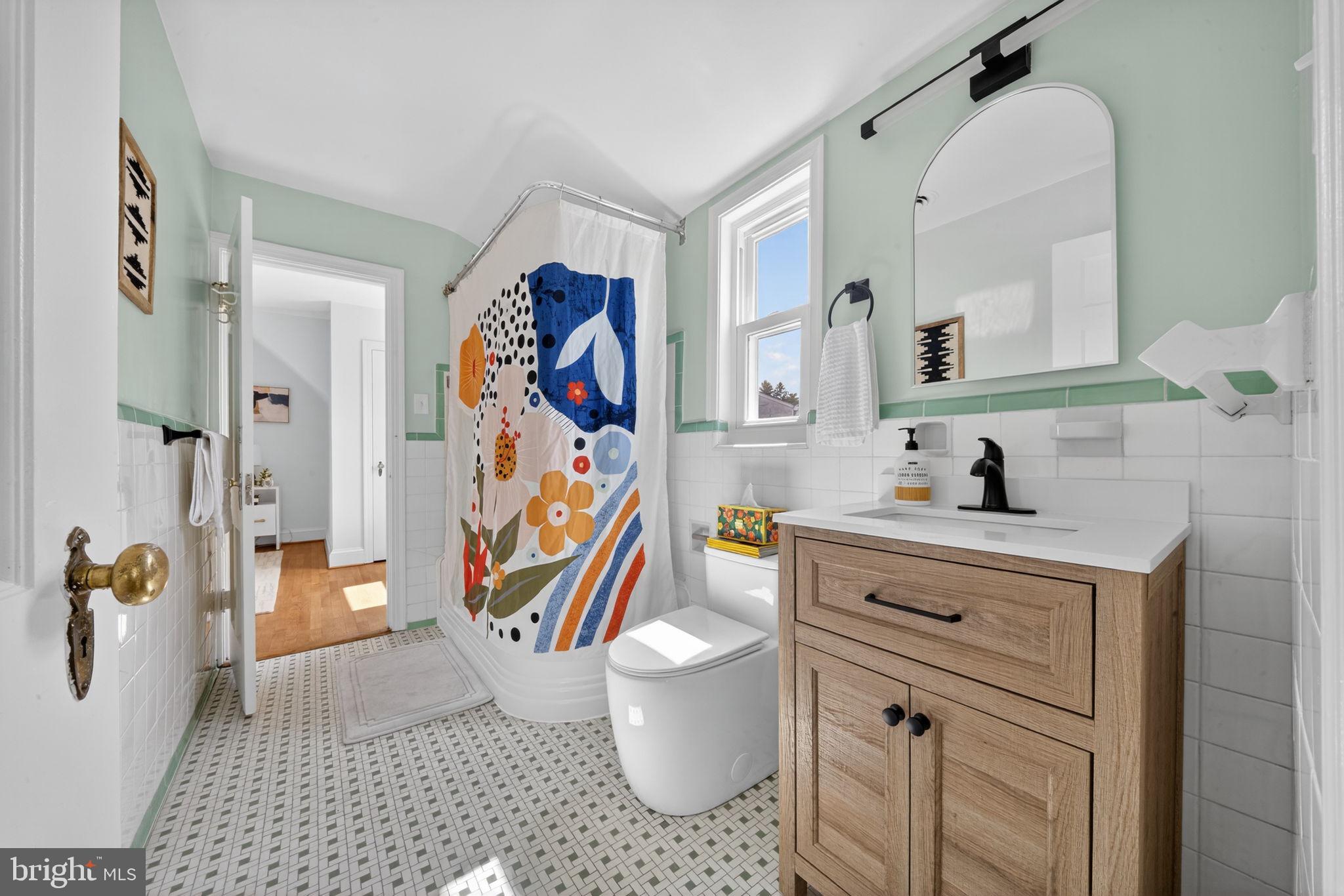 406 Dale Drive Silver Spring, MD 20910 - Photo 40 of 60 a bathroom with a sink toilet and shower