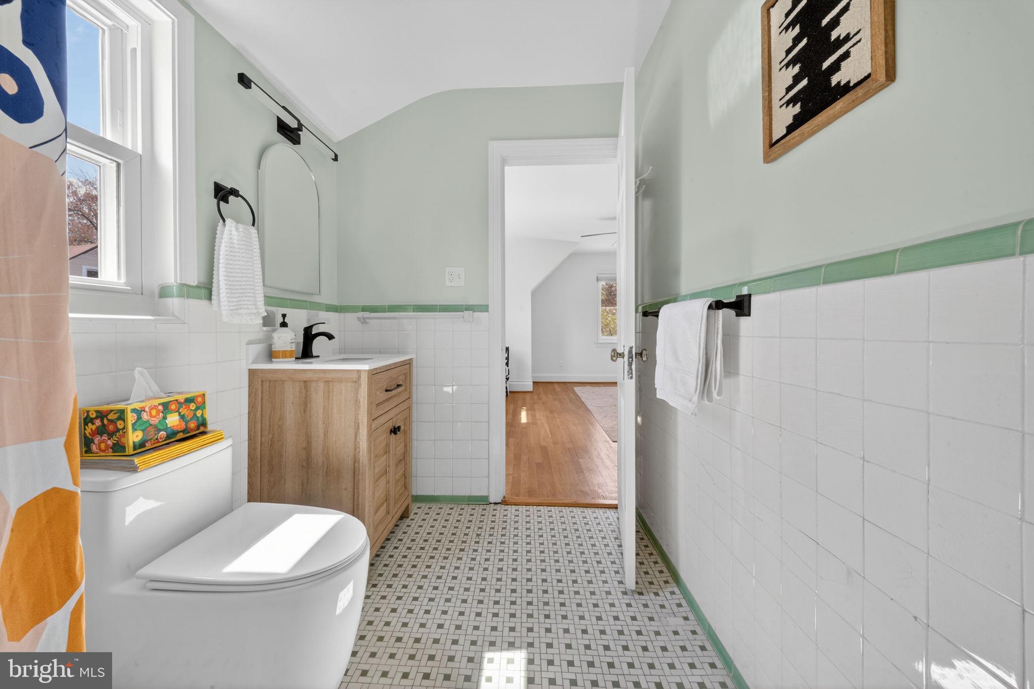 406 Dale Drive Silver Spring, MD 20910 - Photo 41 of 60 a bathroom with a toilet a sink and a shower