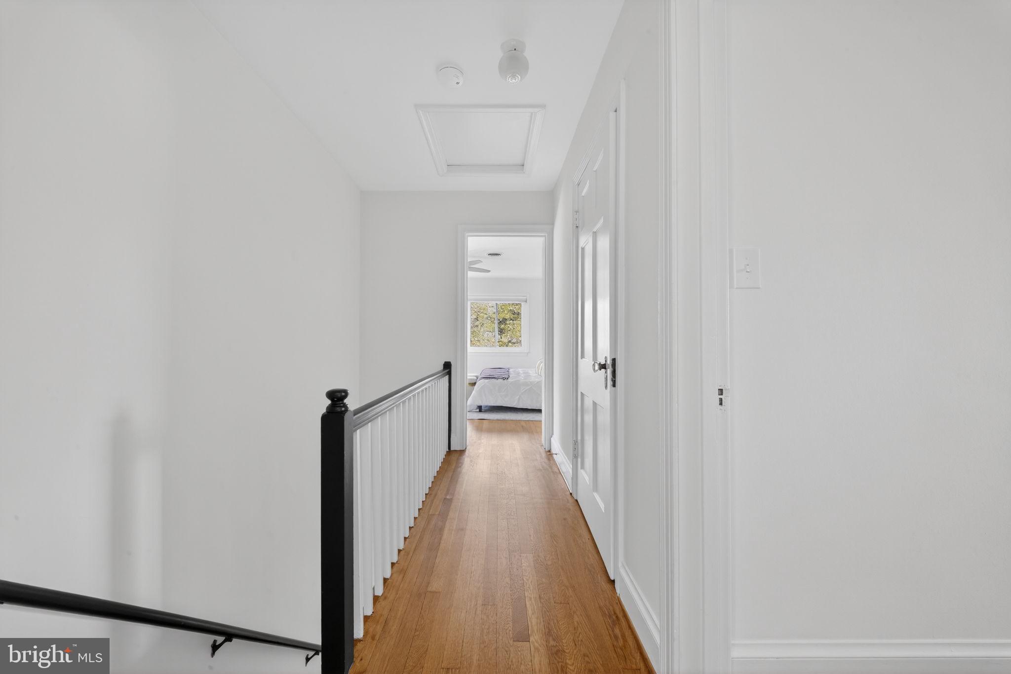 406 Dale Drive Silver Spring, MD 20910 - Photo 42 of 60 a view of a hallway with wooden floor and a bathroom
