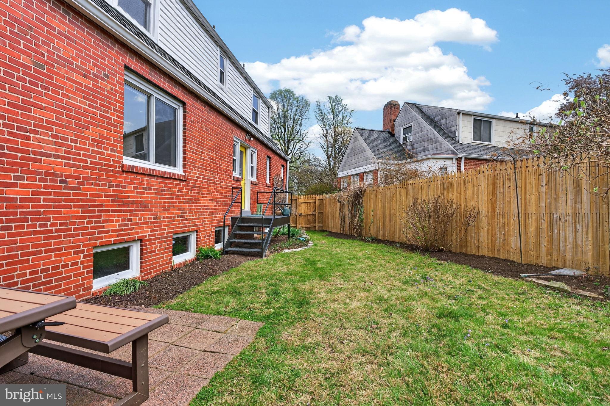 406 Dale Drive Silver Spring, MD 20910 - Photo 54 of 60 a backyard of a house with table and chairs