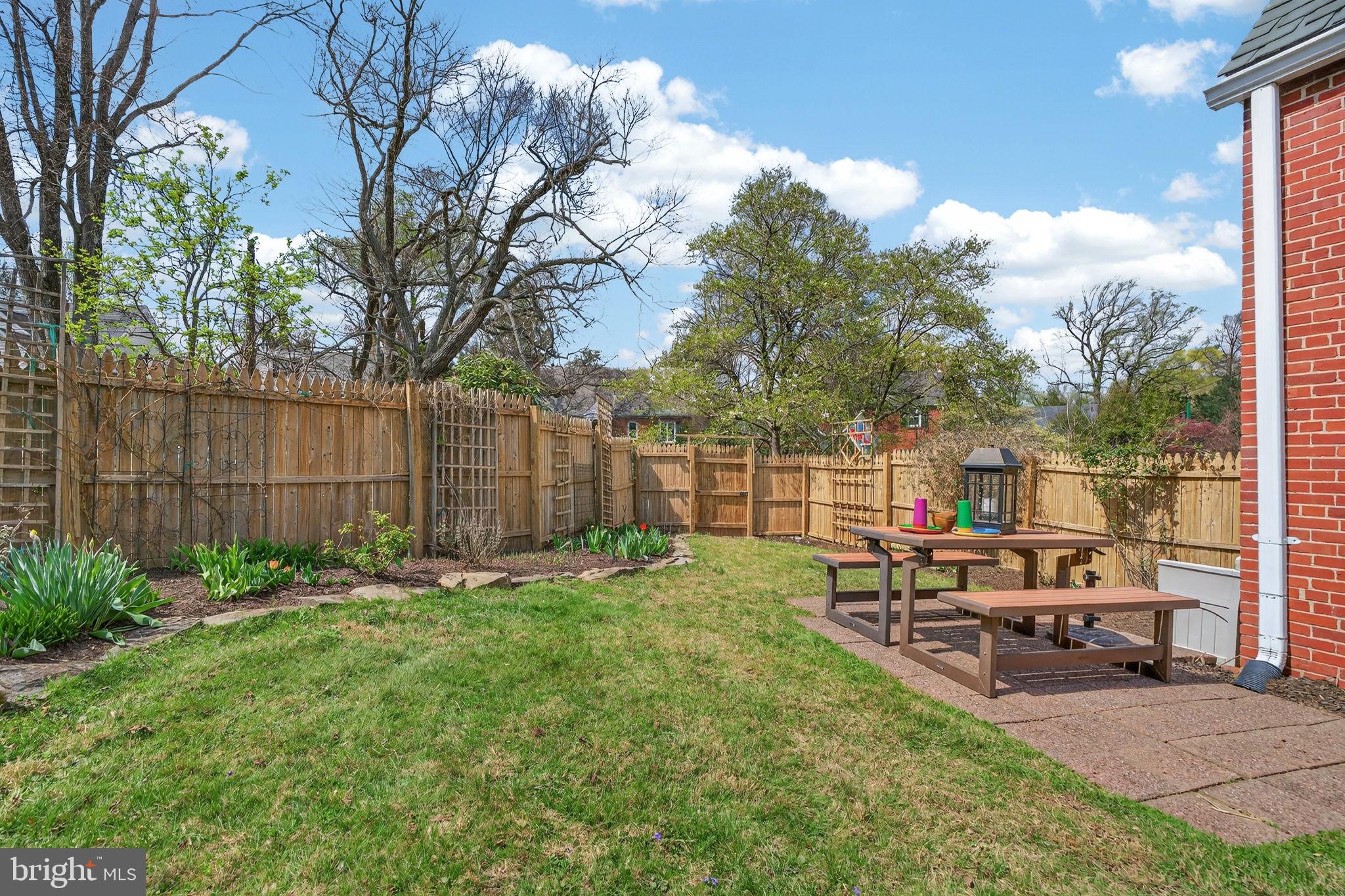 406 Dale Drive Silver Spring, MD 20910 - Photo 55 of 60 a backyard of a house with table and chairs