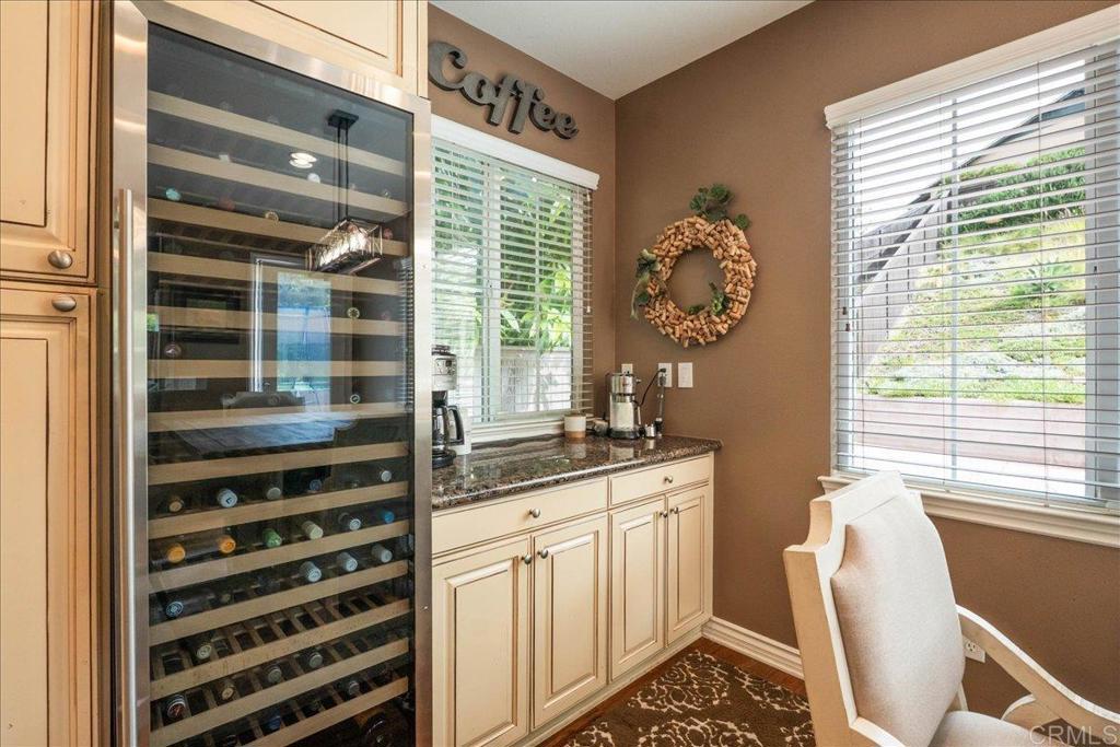 6996 Goldstone Road Carlsbad, CA 92009 - Photo 11 of 49 a kitchen with stainless steel appliances a stove and a window