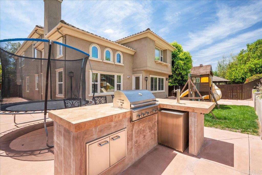 6996 Goldstone Road Carlsbad, CA 92009 - Photo 19 of 49 a view of a house with sink and yard