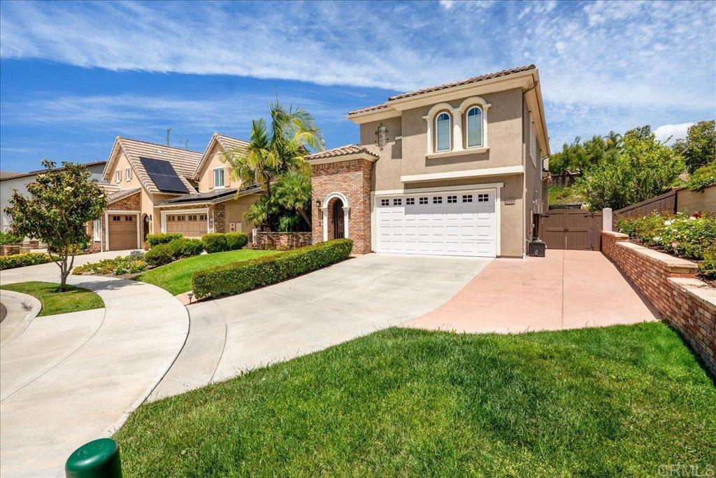6996 Goldstone Road Carlsbad, CA 92009 - Photo 2 of 49 a front view of a house with yard