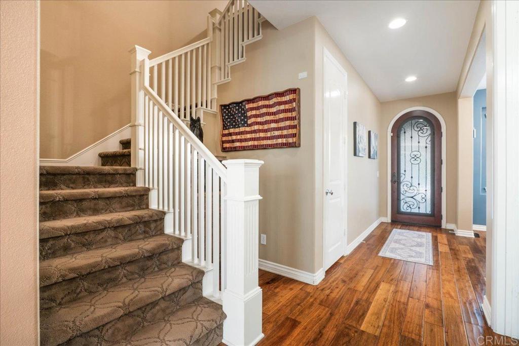 6996 Goldstone Road Carlsbad, CA 92009 - Photo 25 of 49 a view of entryway and hall with wooden floor