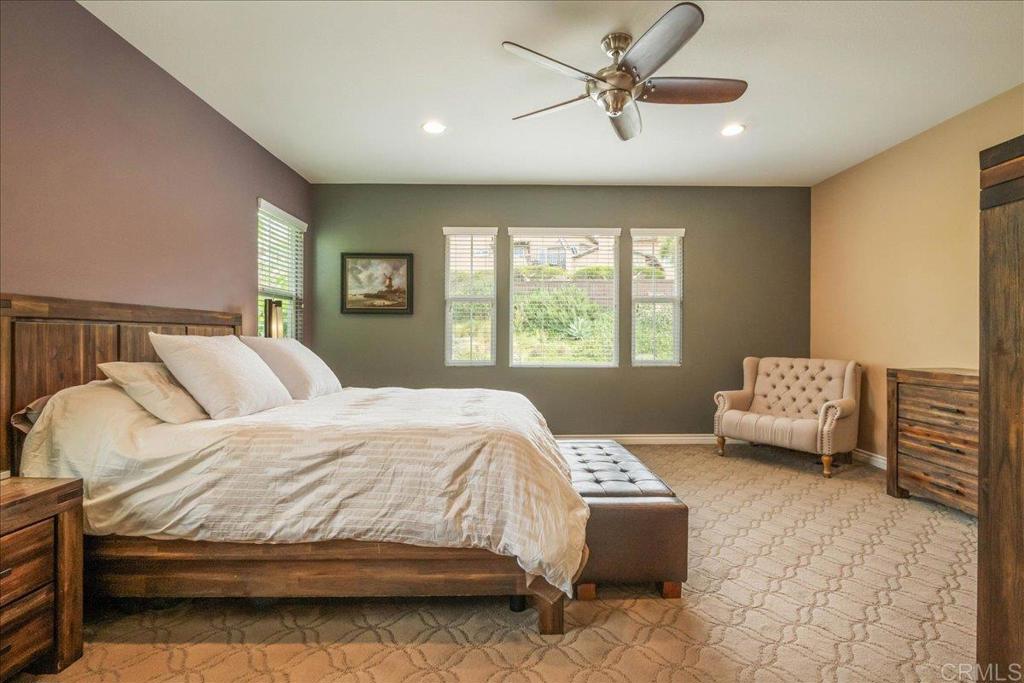6996 Goldstone Road Carlsbad, CA 92009 - Photo 27 of 49 a bedroom with a bed and a couch