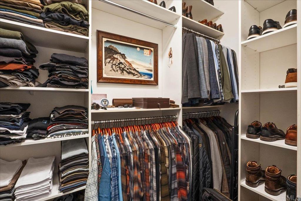 6996 Goldstone Road Carlsbad, CA 92009 - Photo 32 of 49 a view of walk in closet with clothes and shoes
