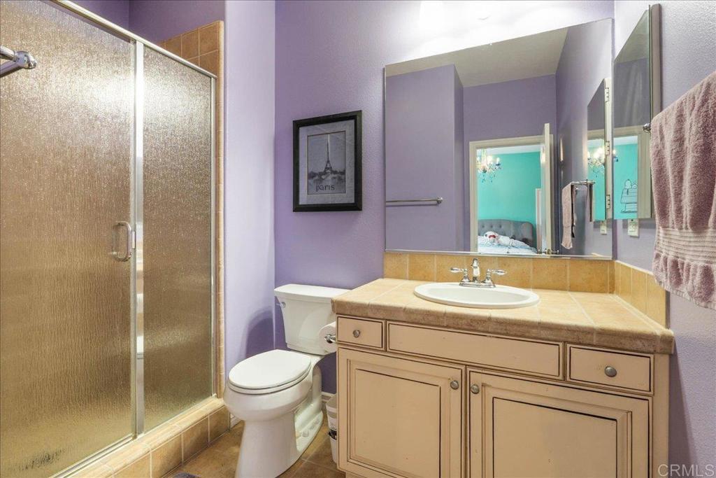 6996 Goldstone Road Carlsbad, CA 92009 - Photo 38 of 49 a bathroom with a sink toilet and shower