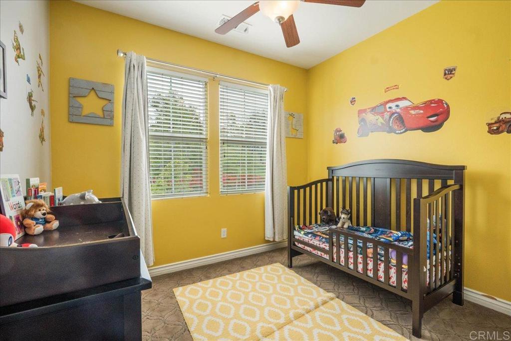 6996 Goldstone Road Carlsbad, CA 92009 - Photo 39 of 49 a bedroom with a bed and a window