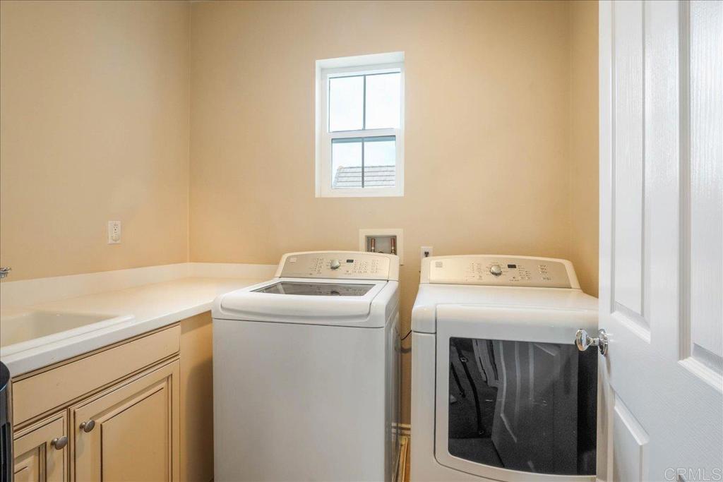 6996 Goldstone Road Carlsbad, CA 92009 - Photo 42 of 49 a utility room with dryer and washer