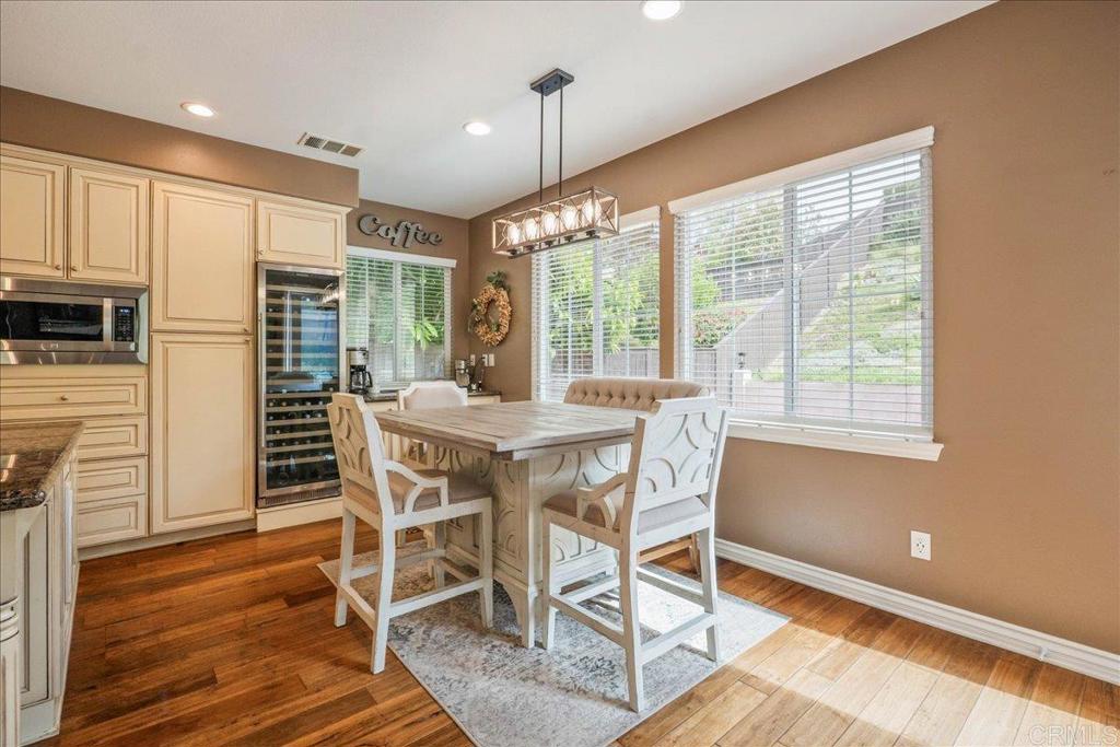 6996 Goldstone Road Carlsbad, CA 92009 - Photo 10 of 49 a dining room with furniture window wooden floor