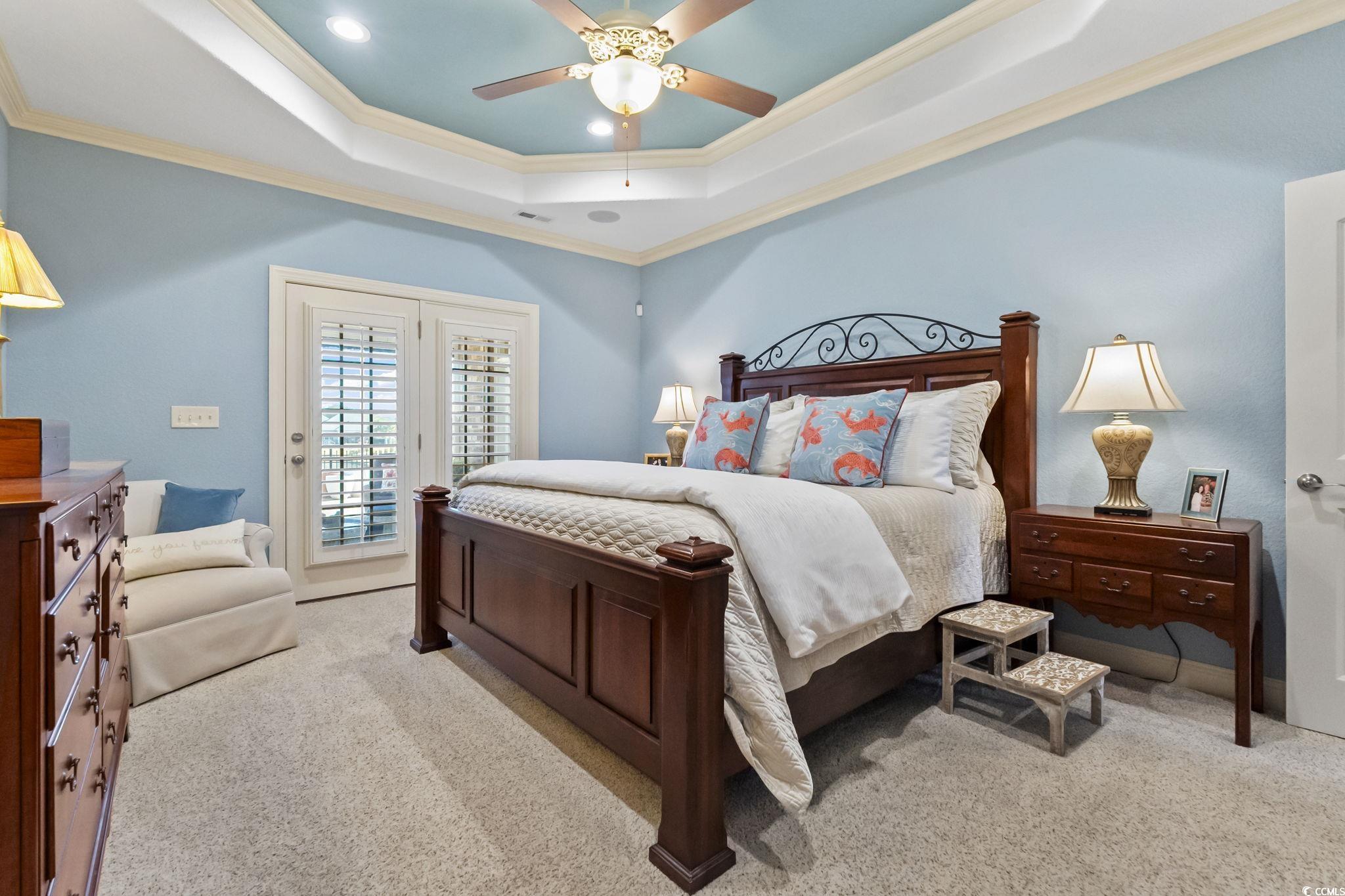 750 Villarosa Drive Myrtle Beach, SC 29572 - Photo 15 of 40 Carpeted bedroom with crown molding, access to outside, a raised ceiling, and a ceiling fan