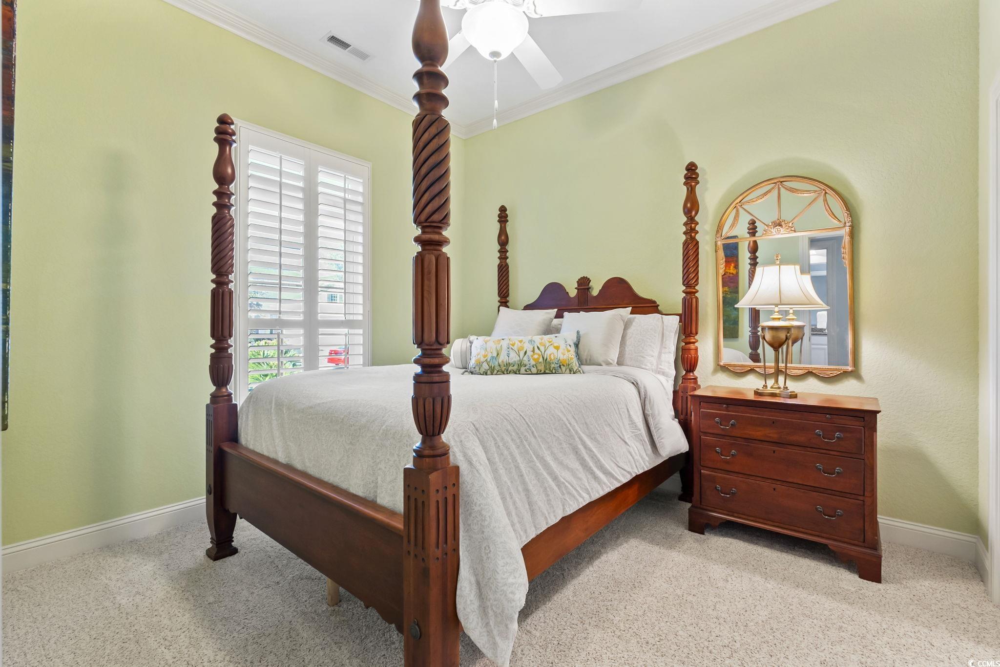 750 Villarosa Drive Myrtle Beach, SC 29572 - Photo 22 of 40 Bedroom featuring a ceiling fan, light carpet, and ornamental molding
