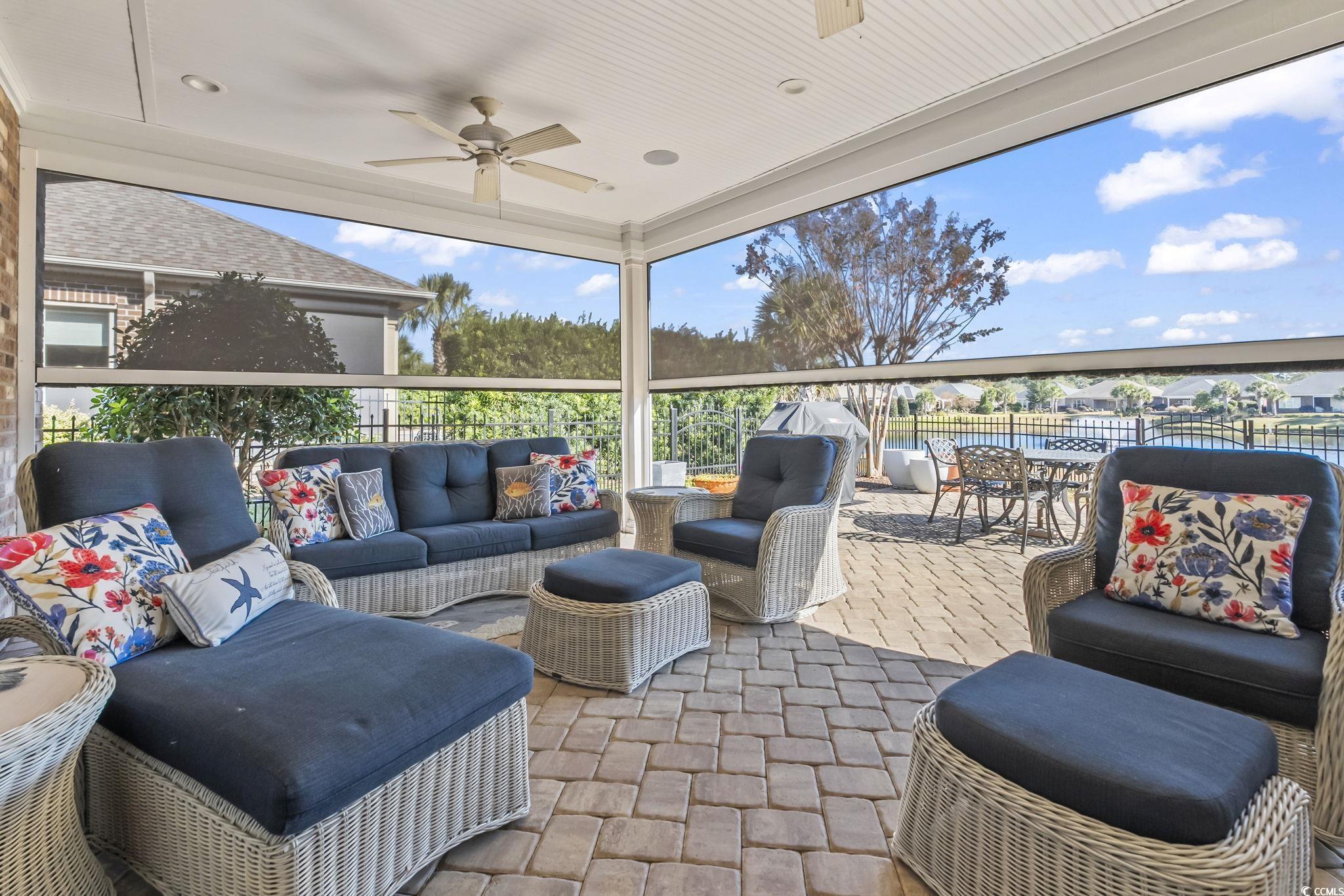 750 Villarosa Drive Myrtle Beach, SC 29572 - Photo 28 of 40 View of patio with an outdoor hangout area, motorized sunshades, two ceiling fans, and outdoor dining space