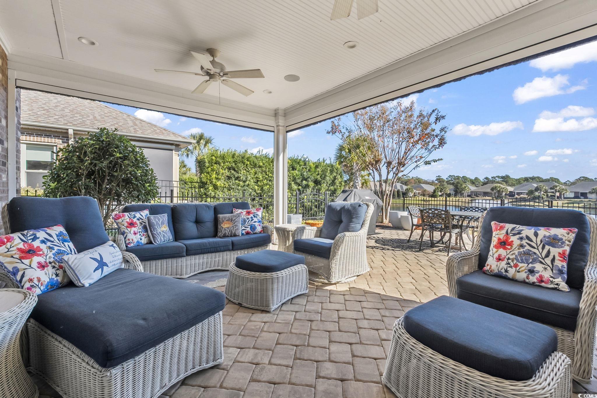 750 Villarosa Drive Myrtle Beach, SC 29572 - Photo 29 of 40 View of patio / terrace with outdoor lounge area, ceiling fan, outdoor dining area, and a residential view