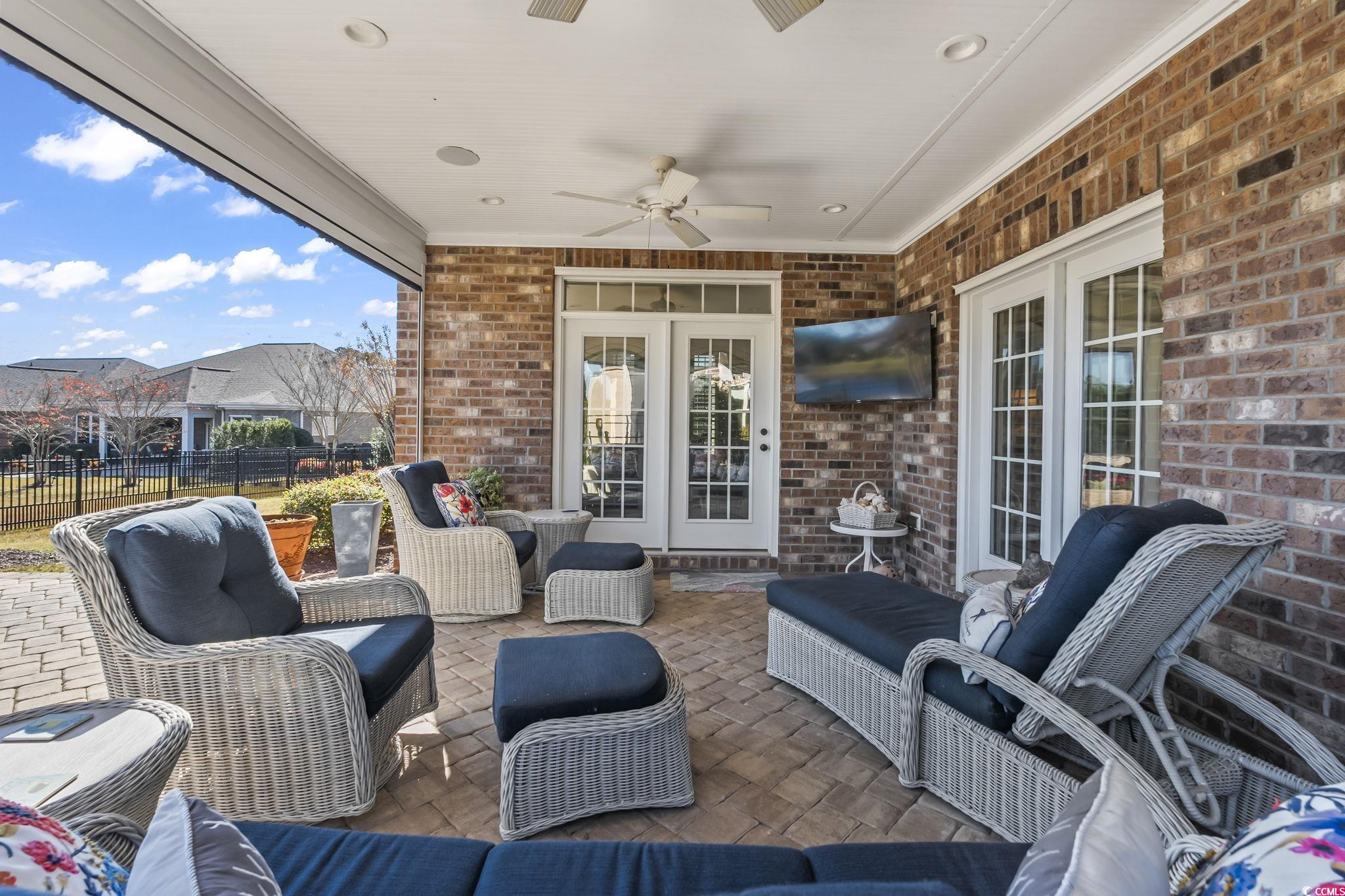750 Villarosa Drive Myrtle Beach, SC 29572 - Photo 30 of 40 View of patio / terrace featuring an outdoor living space, a ceiling fan, and french doors