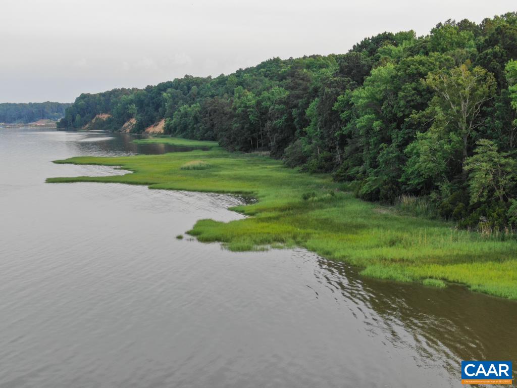 A Ware Creek Road Williamsburg, VA 23188 - Photo 11 of 25 a view of a golf course with a lake
