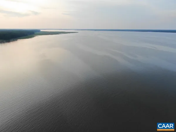 a view of a field with a lake