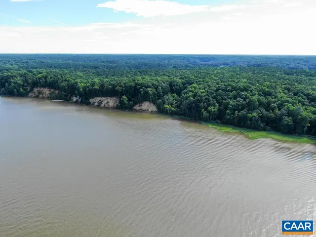 a view of a field with an ocean