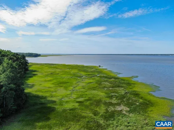 a view of lake with green space