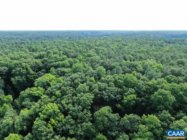 a blue sign that is sitting on a wall