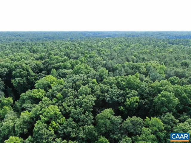 a blue sign that is sitting on a wall