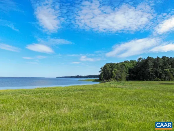 a view of a golf course with a lake