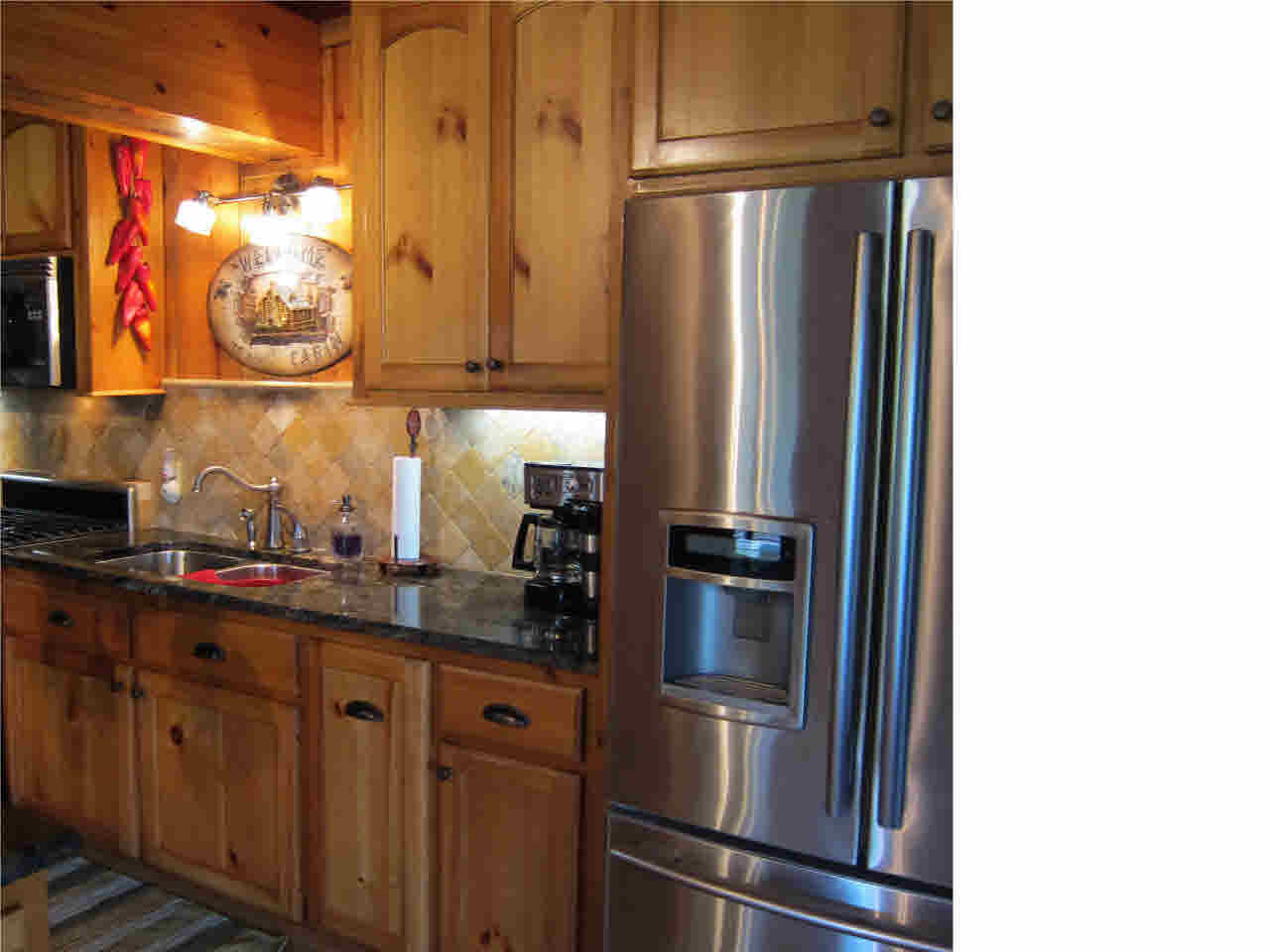 136 Brook Ridge Lane, Unit A Canton, MS 39046 - Photo 13 of 36 Gorgeous wood and granite kitchen view