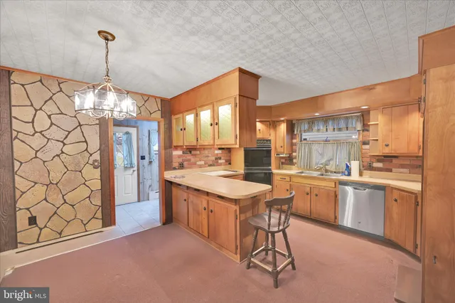 an empty room with sliding door and wooden floor