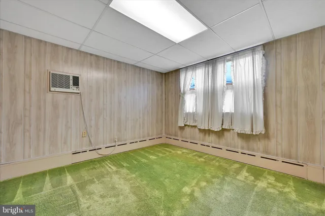 a view of a house with more windows and potted plants