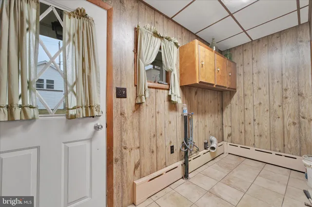a view of a dining room with furniture and a window