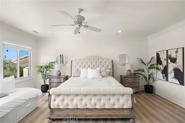 a living room with furniture a chandelier and a fireplace
