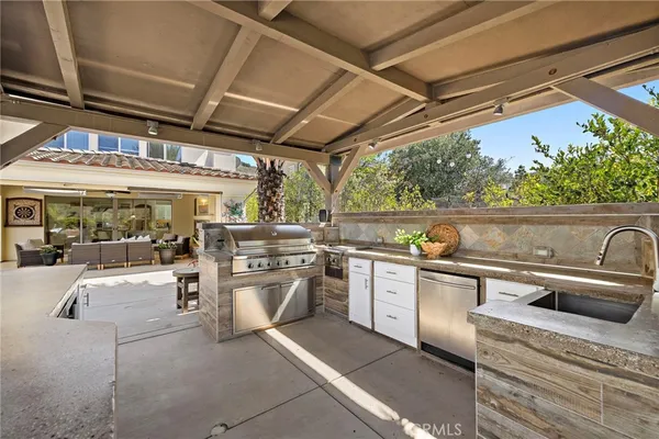 a building outdoor space with patio furniture and potted plants